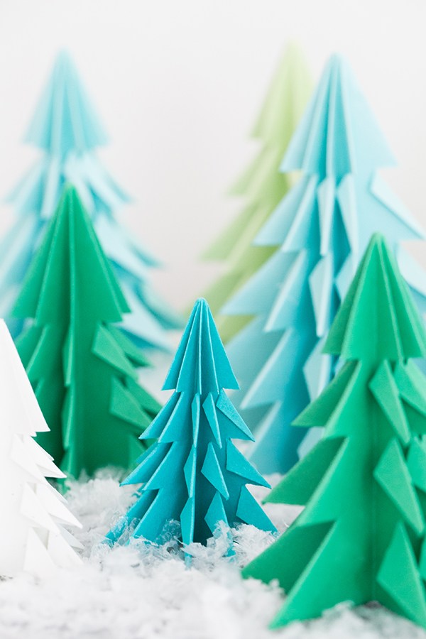 Origami Christmas trees in blue and green.