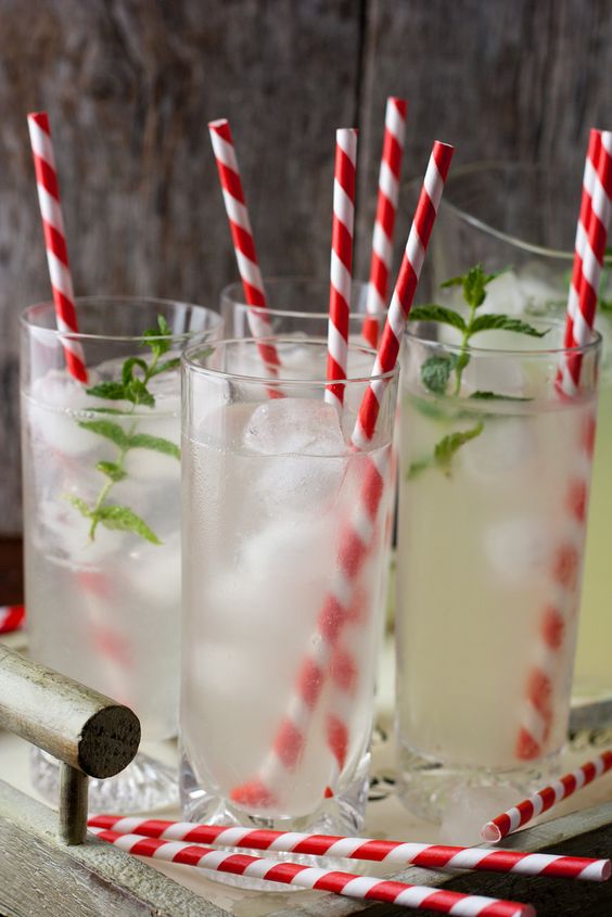Red straws in a clear glass.