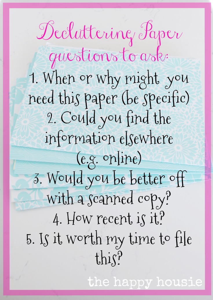 5 questions to ask yourself when you are decluttering paper and organizing paperwork and files as part of the 10 work organizing challenge for your entire home