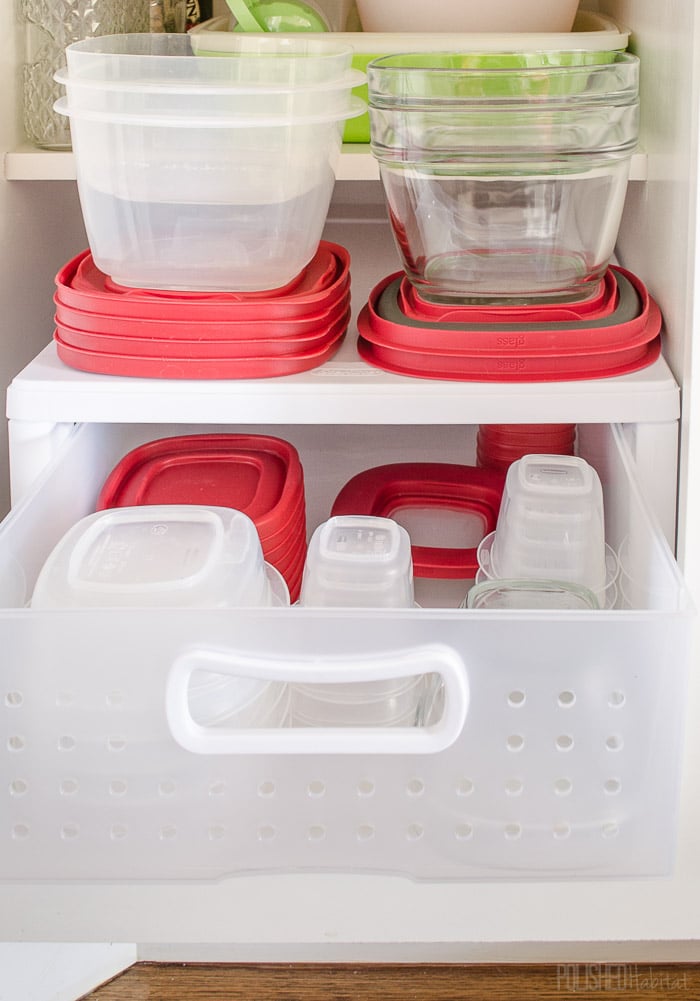 Tupperware and their lids all neatly stored.