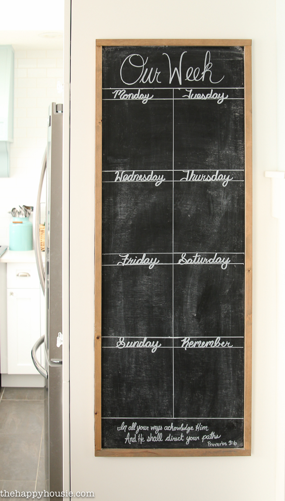 The chalkboard with the schedule on it.