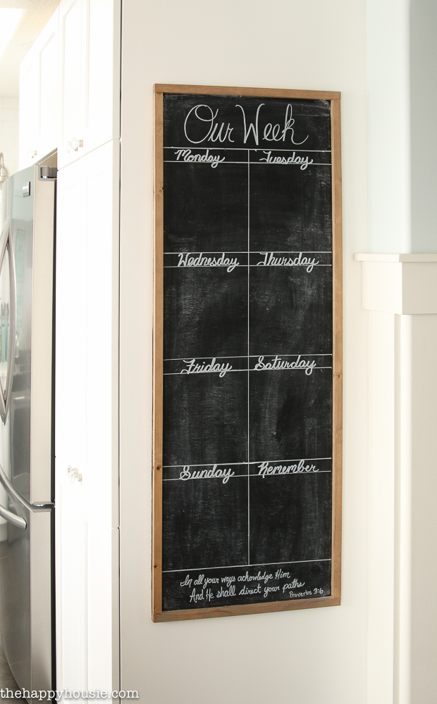 The chalkboard with days of the week on it.