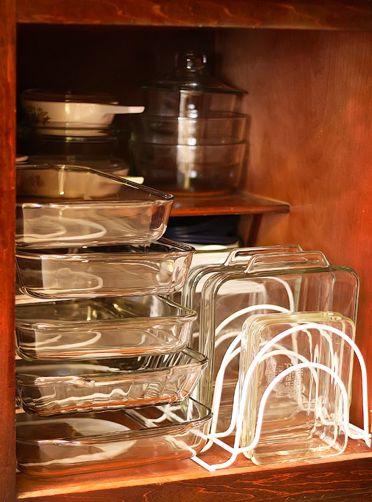 Clear glass dishes in a cupboard.