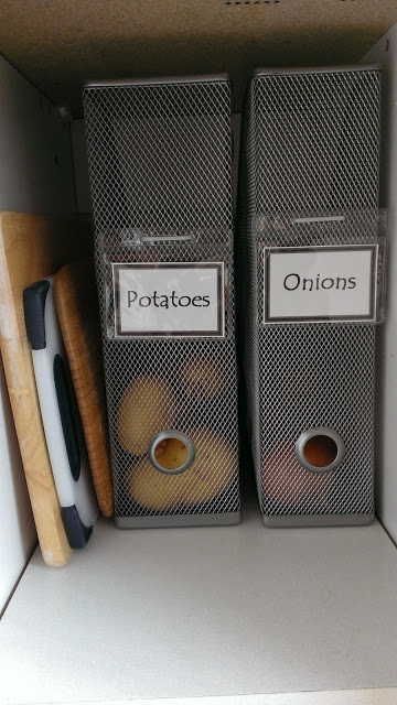 Magazine holders that contain potatoes and onions.