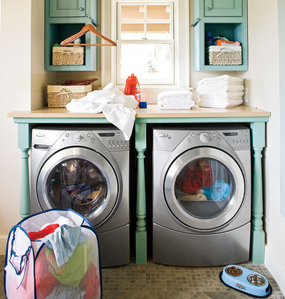 A turquoise shelf is built around the washer and dryer.