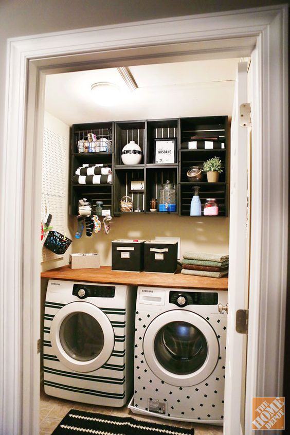 A washer and dryer decorated with black washi tape decals.