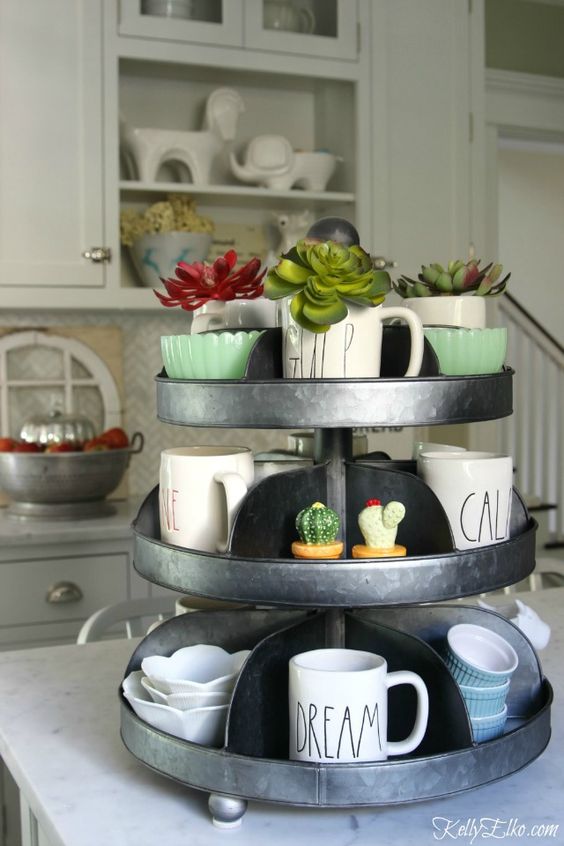A steel galvanized tray with succulents and coffee cups.