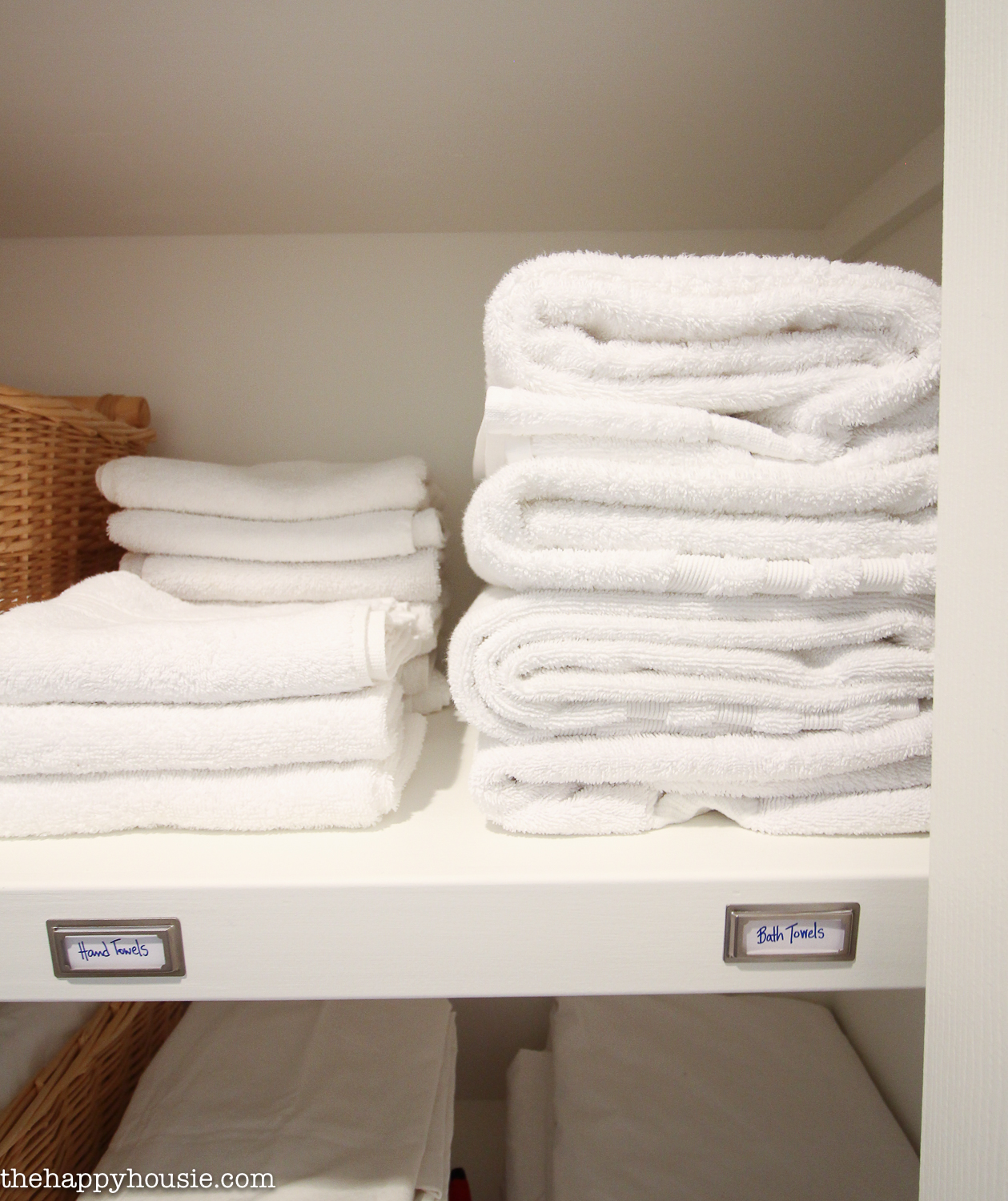 Folded towels on the shelf.