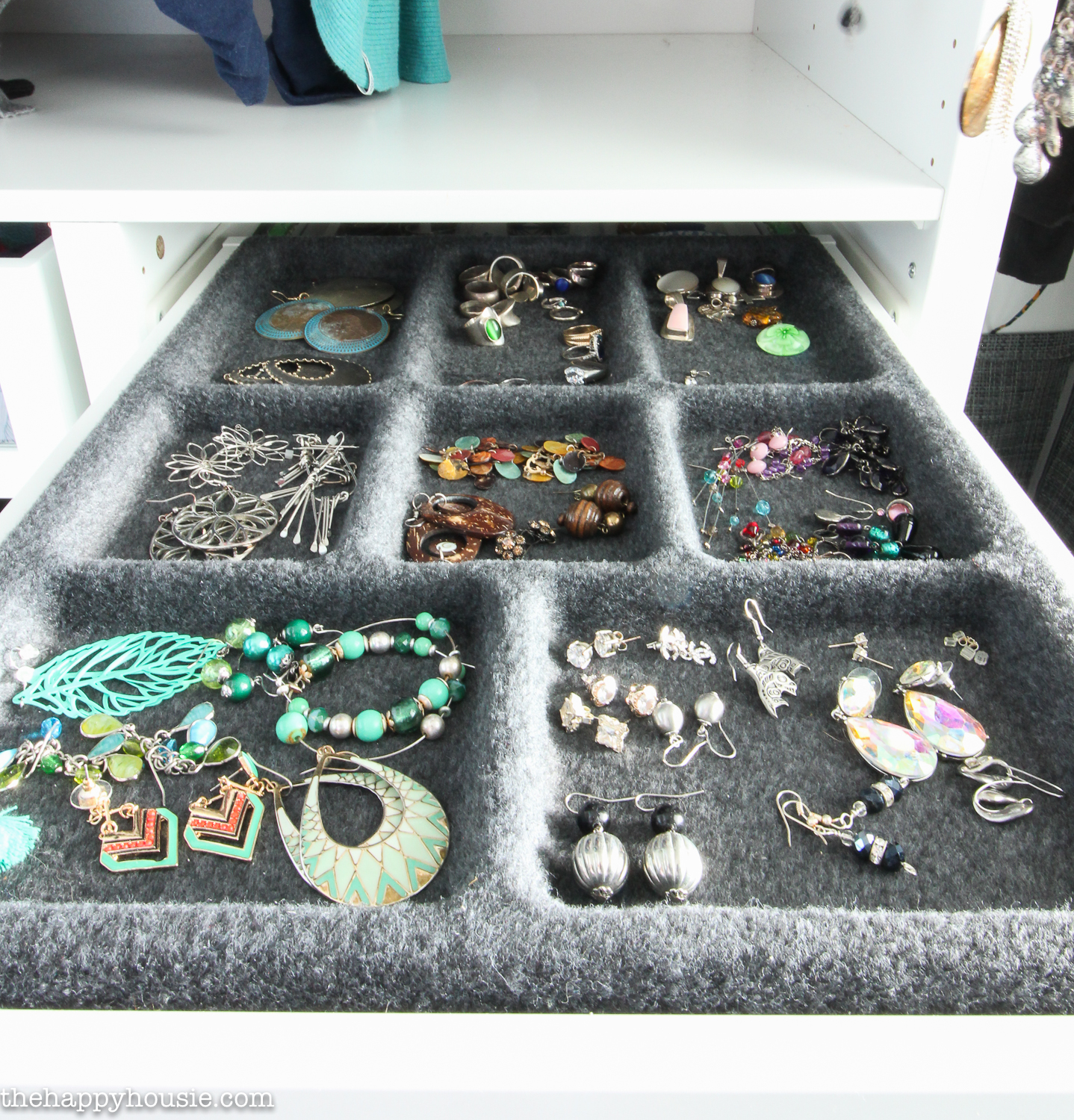 Trays filled with earrings.
