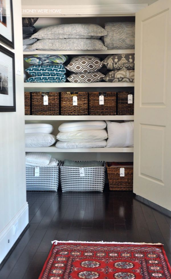 Throw pillows and wicker baskets in the closet.