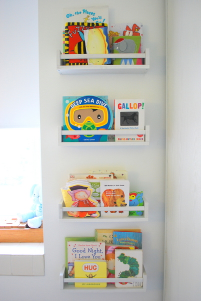 White shelves holding children's books.