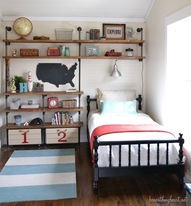 A small bed with shelves built in around it in a boys room.