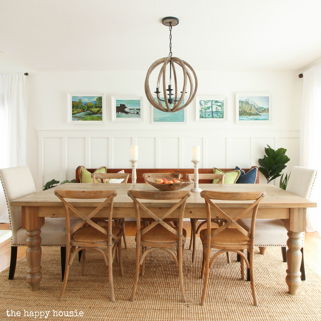 Simply white in the dining room with a wooden table and chairs.