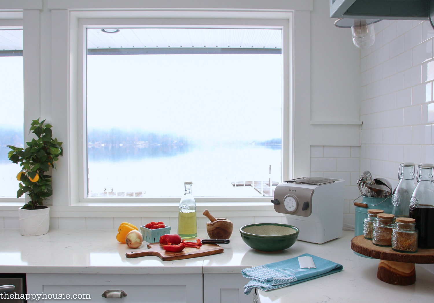 A large window overlooking the lake in the kitchen.