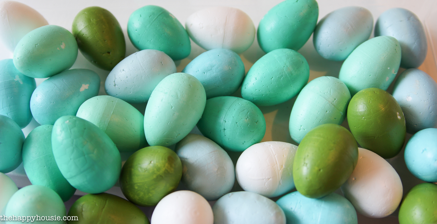 Styrofoam eggs in shades of green and blue.