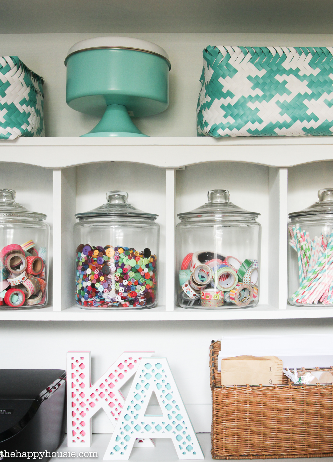 Glass jars filled with DIY supplies.