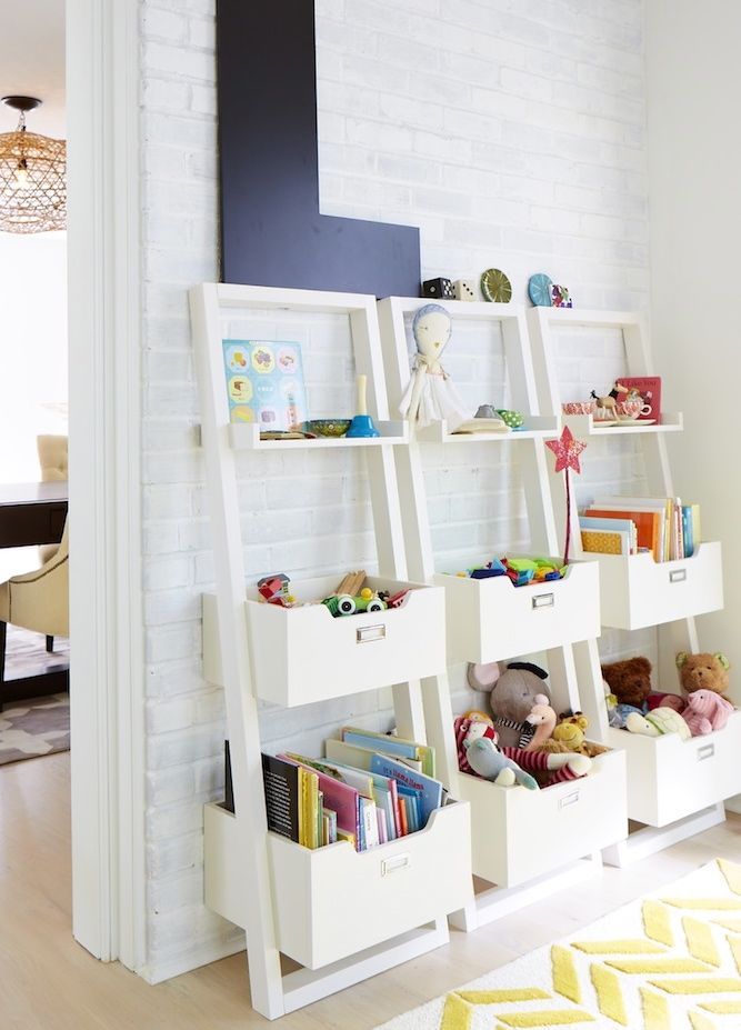 Ladder shelves with kid's toys.