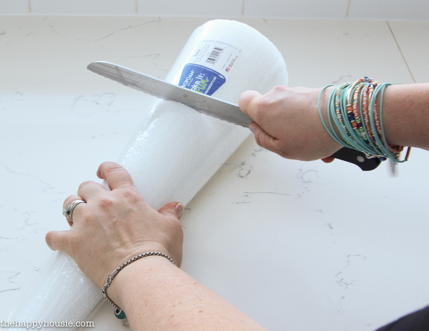 Cutting a piece of styrofoam to size.