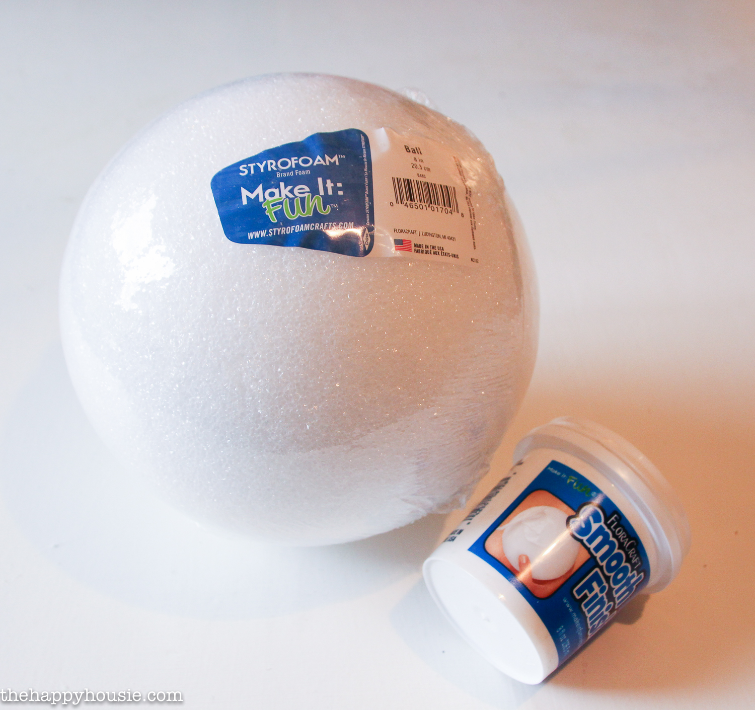 A foam ball and smooth finish both in their packages on the counter.