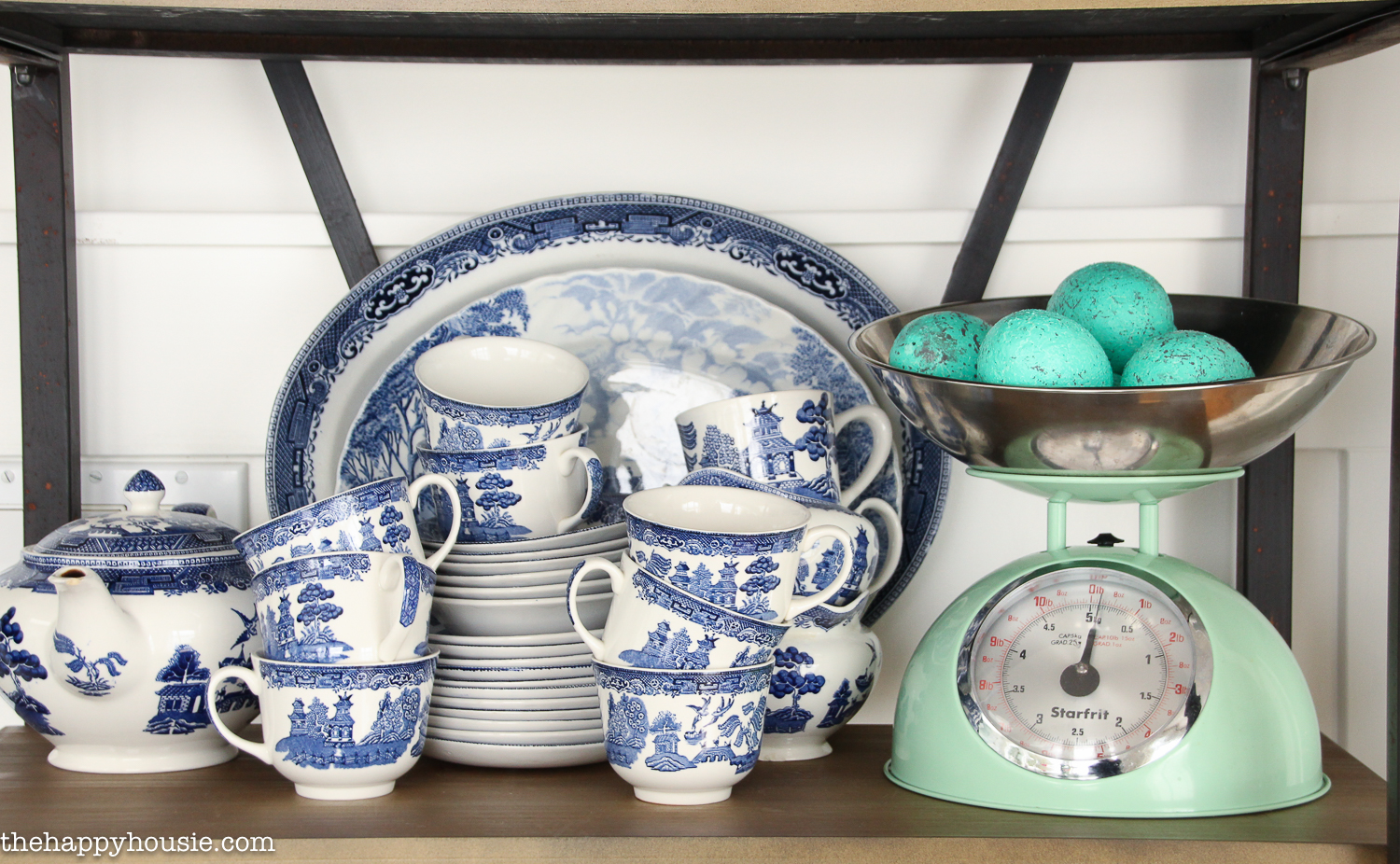 Up close shot of blue and white dishes on the shelf.