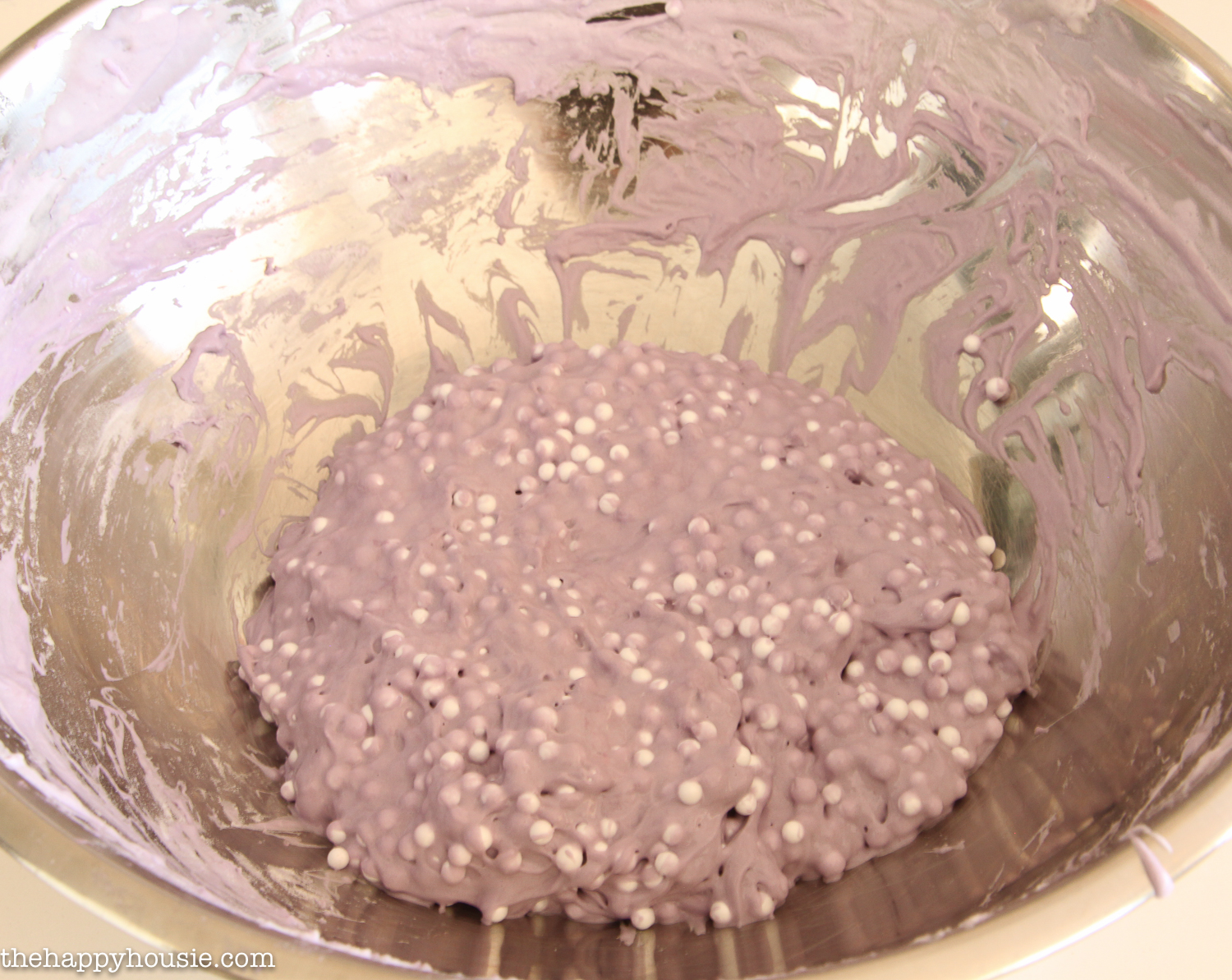 A small ball of slime being mixed in the bowl.