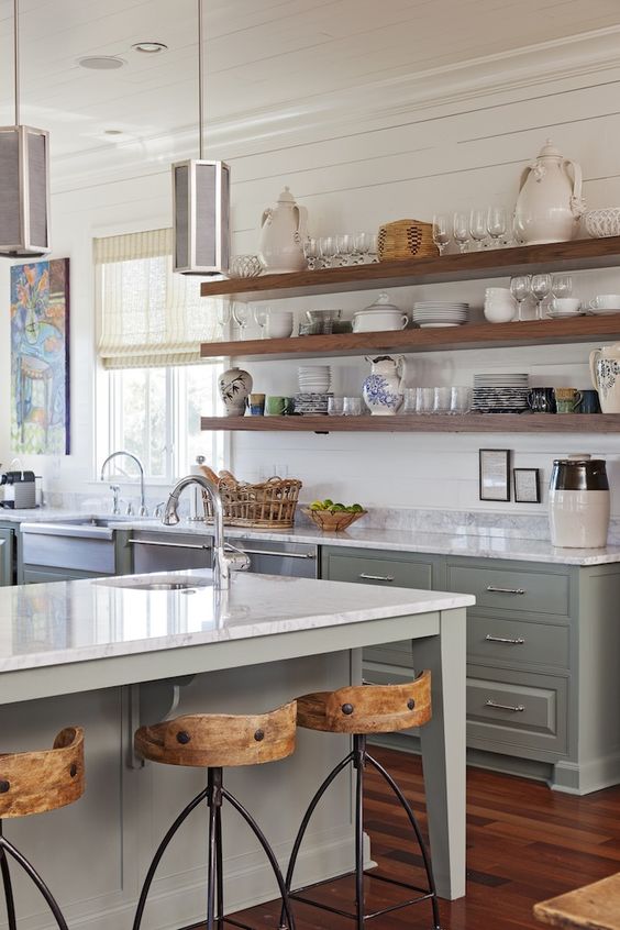 A light bright airy white and soft mint green kitchen with open shelves.