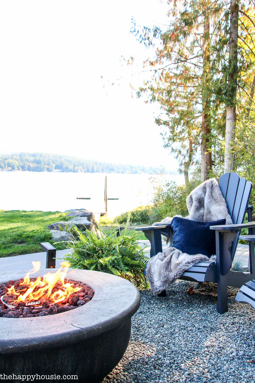 A outdoor firepit by the lake.