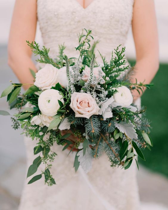 A fresh green bouquet with white flowers.