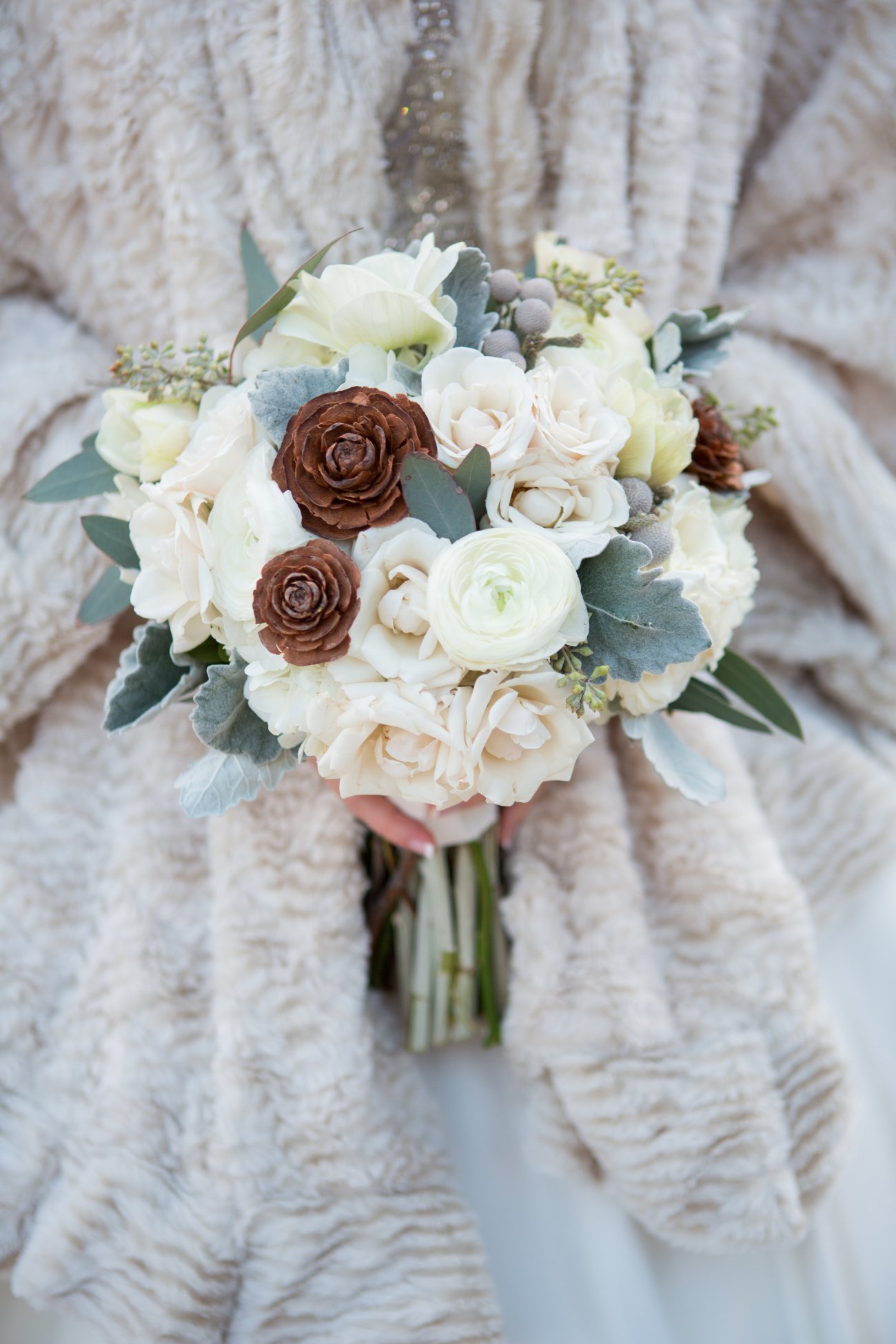 Pinecones in a bridal bouquet.