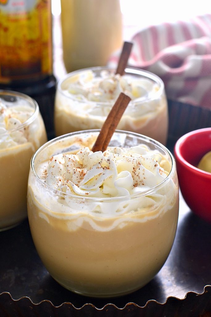 Eggnog with whip cream and cinnamon on top.