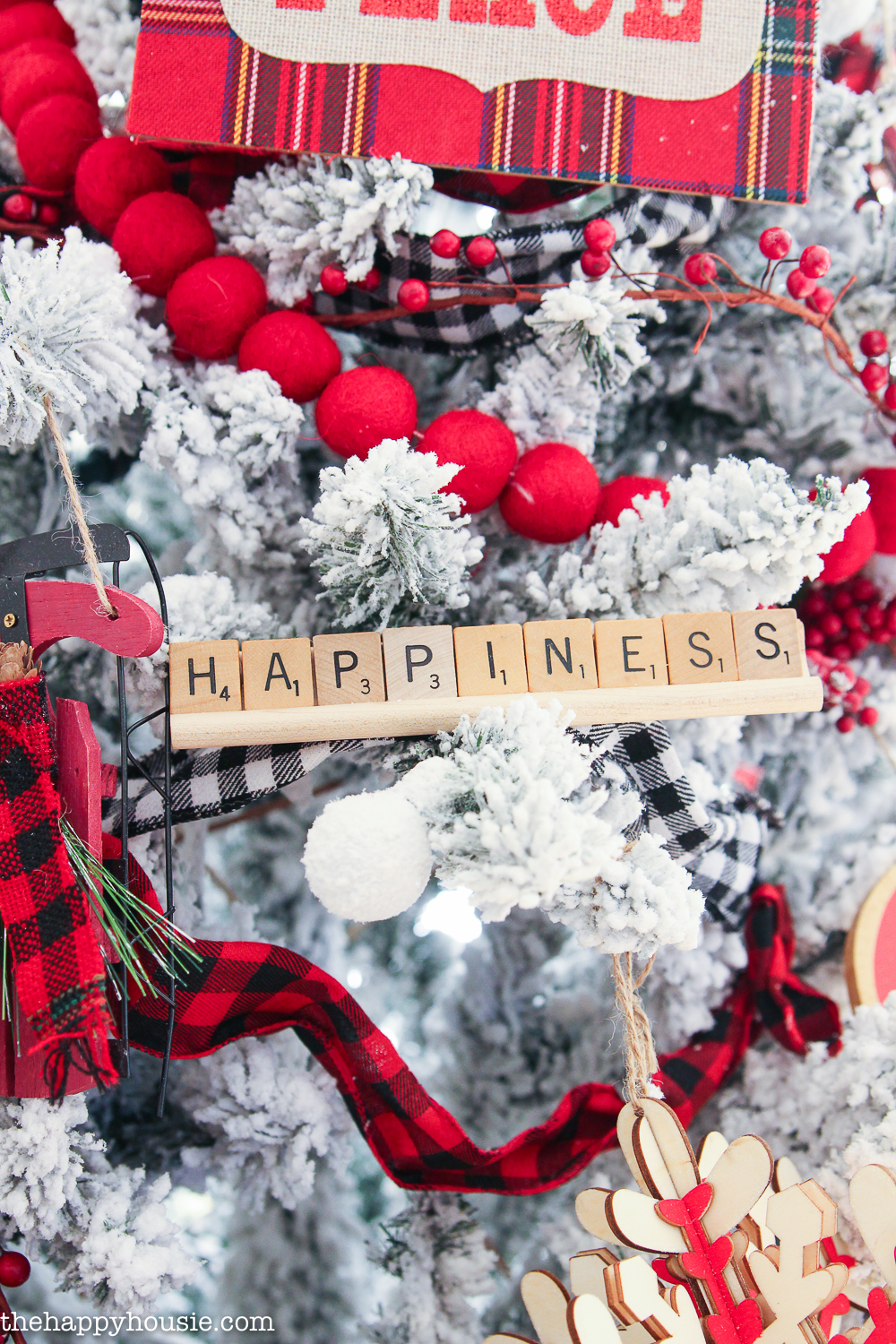 Up close shot of the word happiness in scrabble blocks.