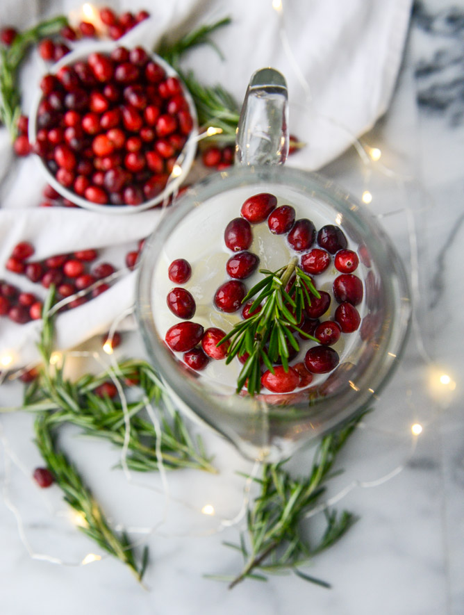 Cranberry punch with sprigs of rosemary.