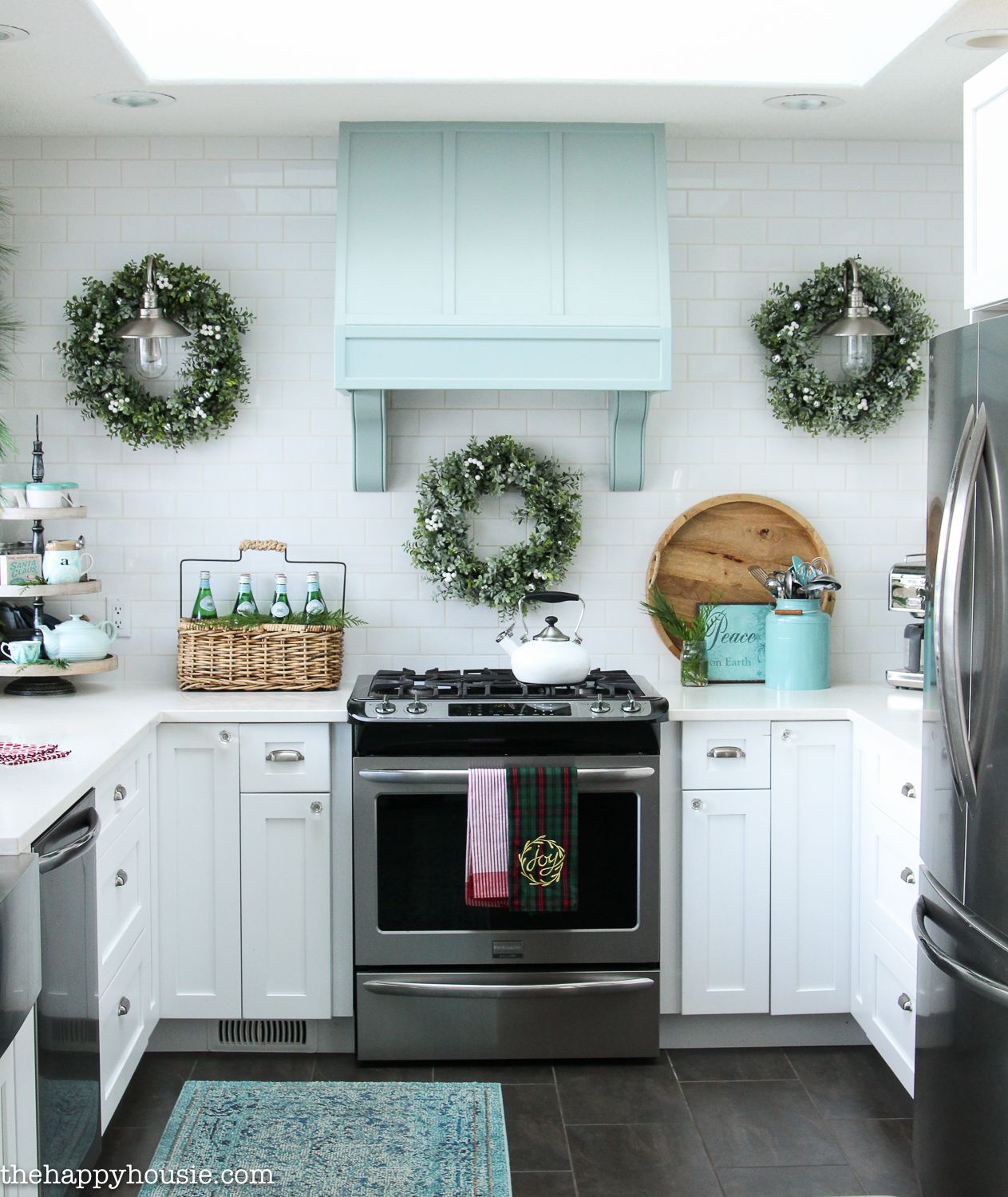 A blue and white kitchen decorated for Christmas.