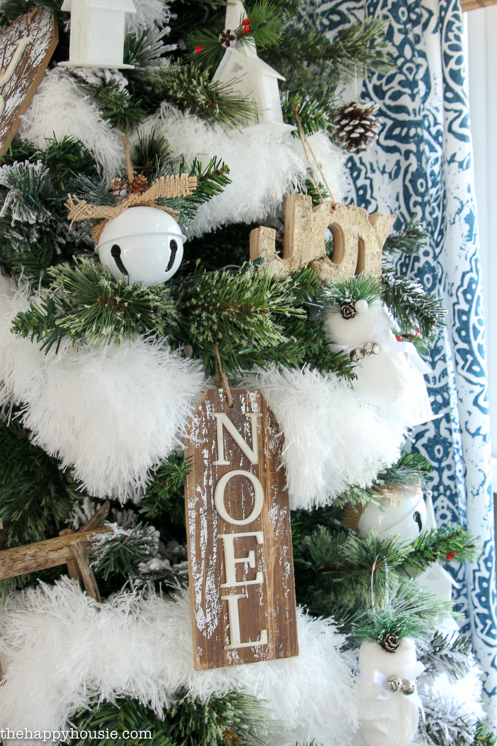 Wooden signs adorn the tree.