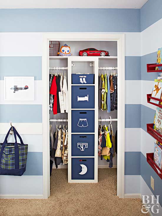 A blue and white striped child's room with a small reach-in closet.