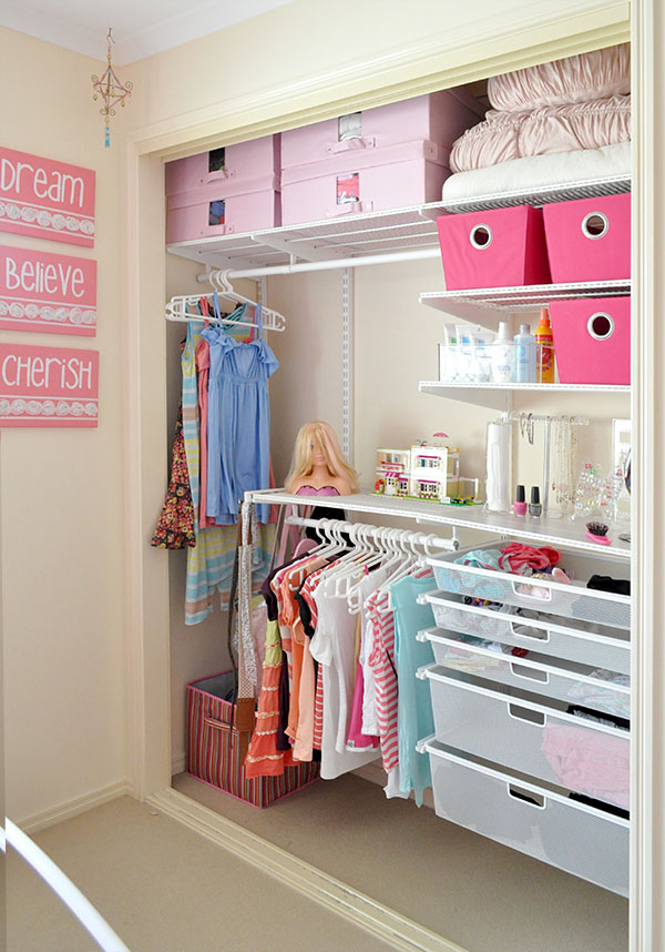 A pink inspired small closet.