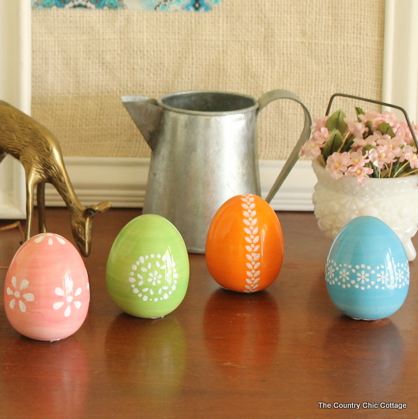 Pretty eggs in orange, green blue and pink with white designs.