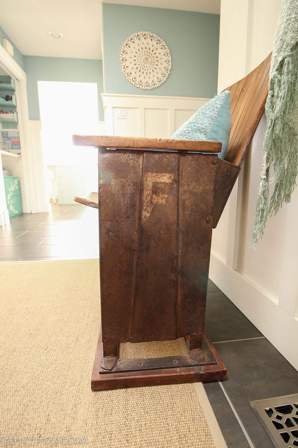 An antique looking chair in the front entryway.