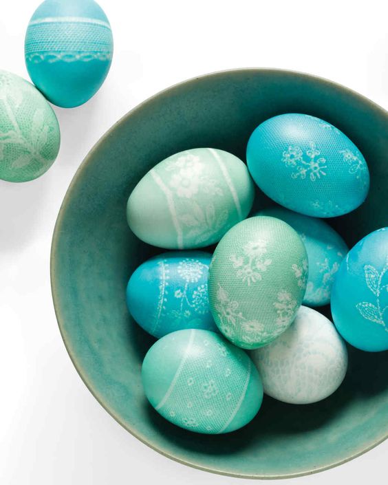 Dyed eggs in a bowl with patterns on them.