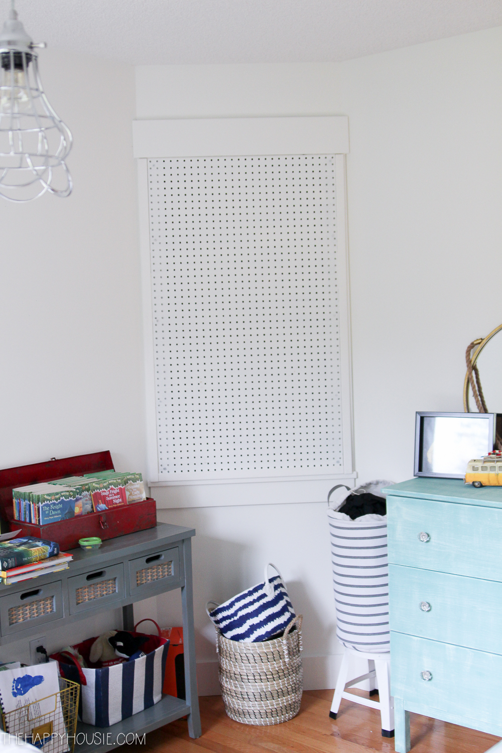 There is a pegboard on the wall.