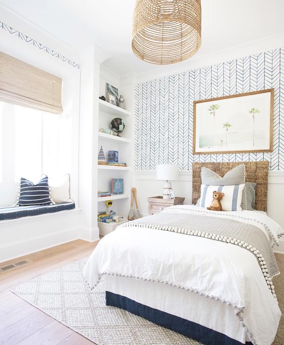 A children's bedroom with blue and white nautical details.