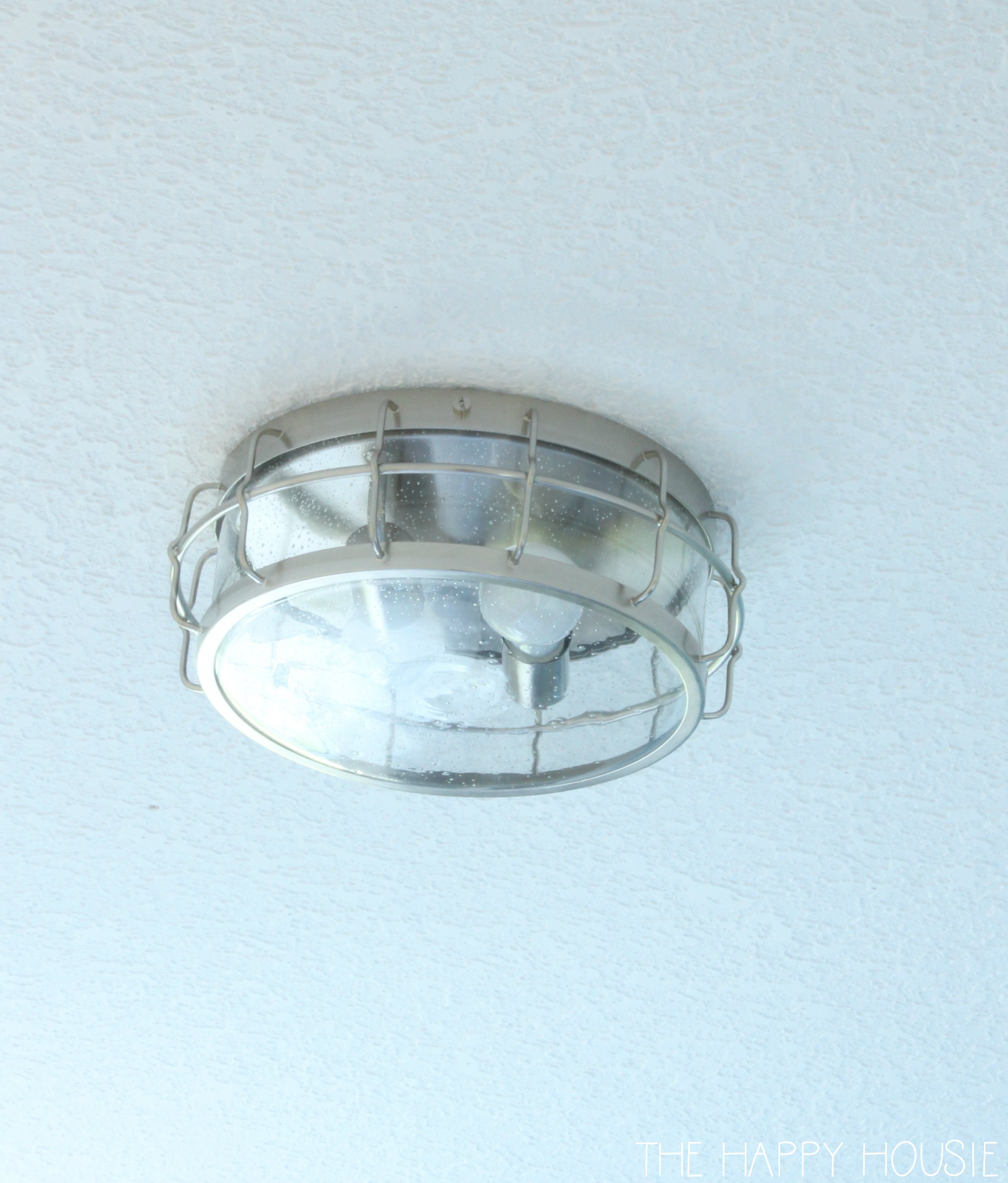 The flush mount light in the ceiling.