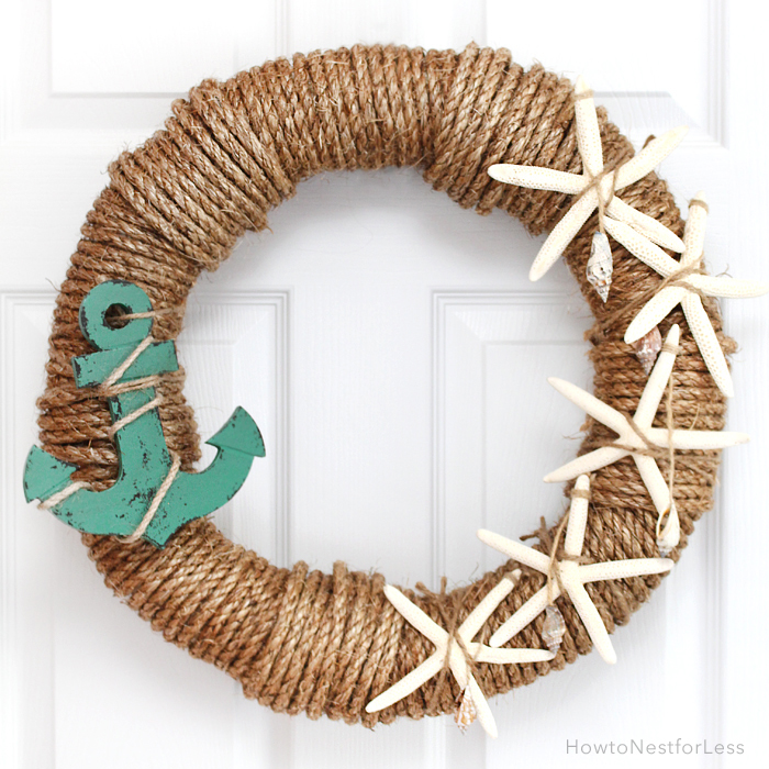 A beachy nautical rope wreath with shells and an anchor.