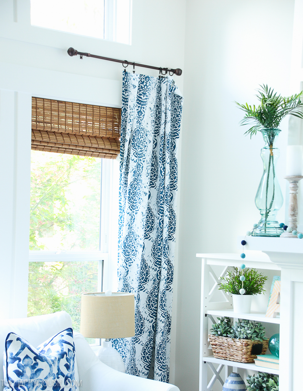 The blue and white patterned curtains hanging in the living room.