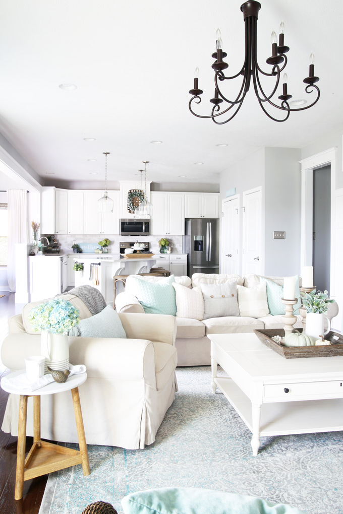 White couches and a white coffee table in a white living room.
