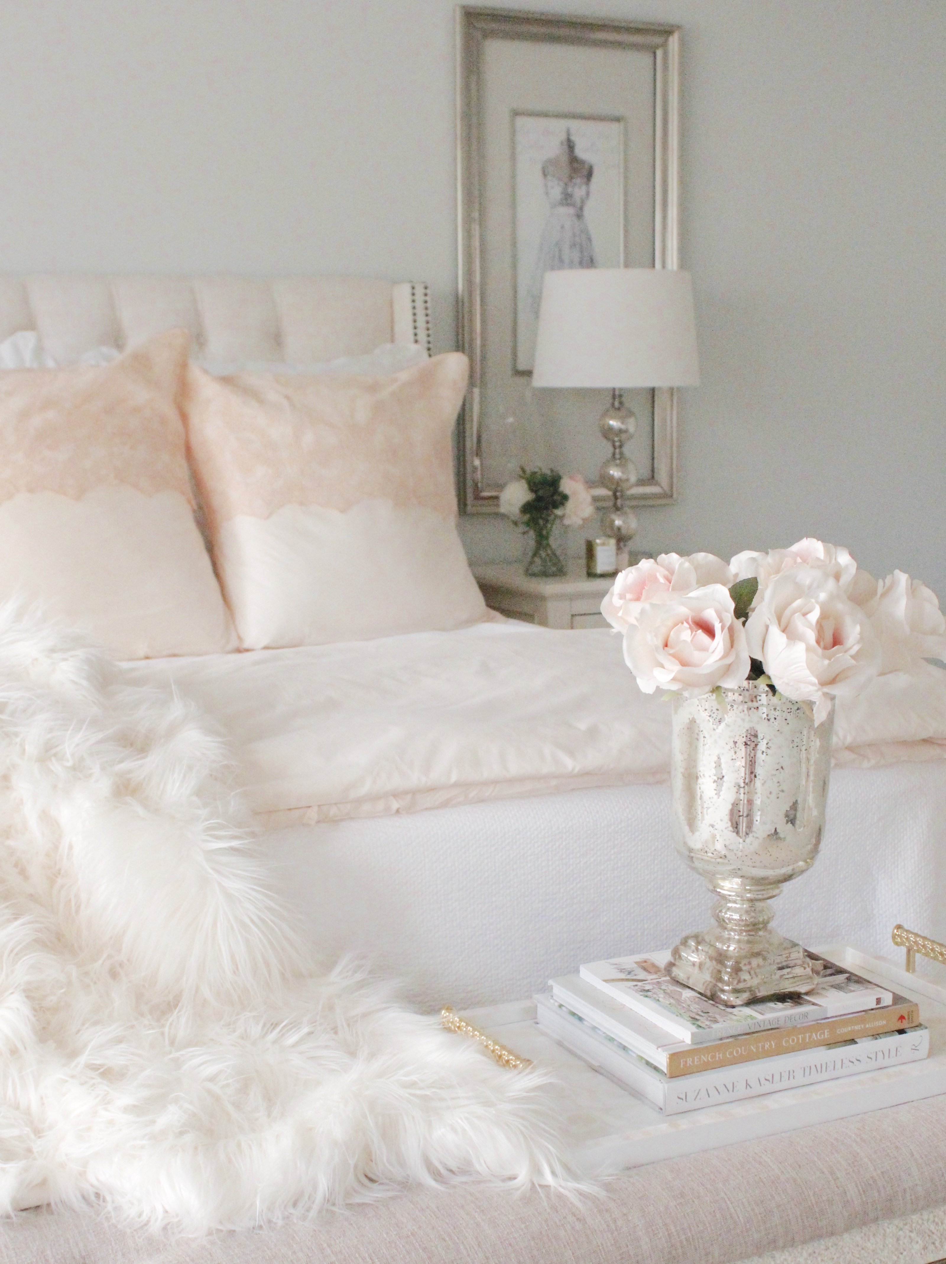 Light pink and pink flowers in a primary bedroom.