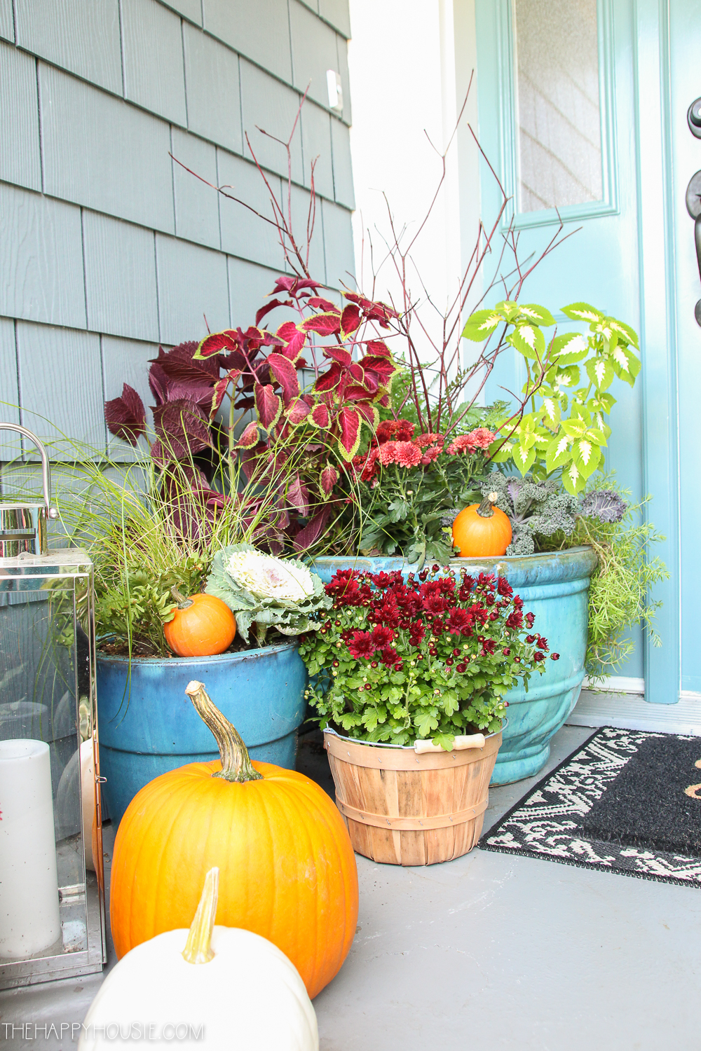 Pumpkins and planters on the porch.