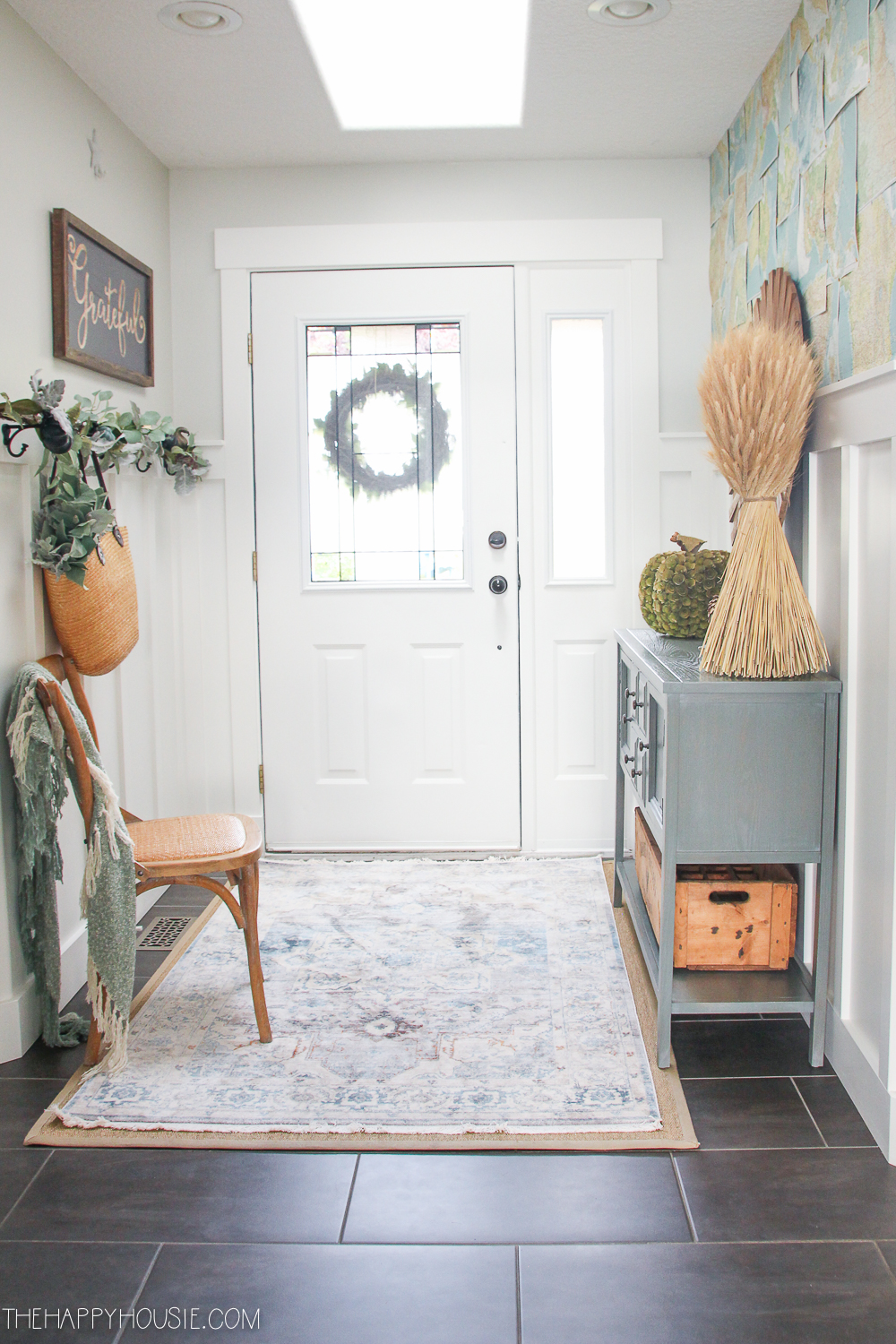 Layered rug look on the floor in front of the door.