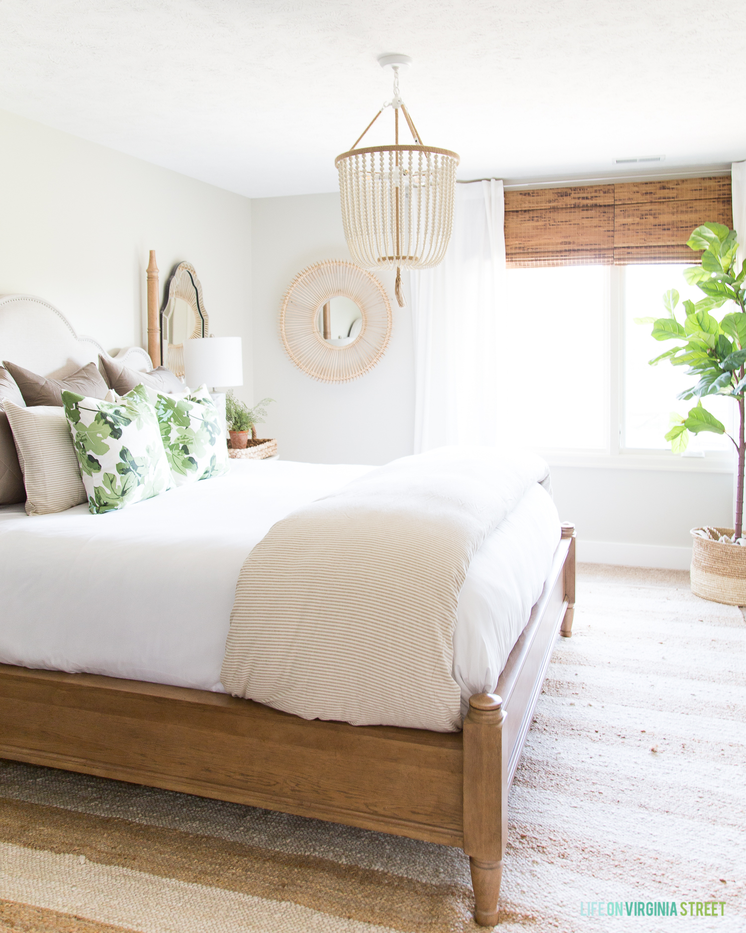 Wood and white with a beaded light above the bed.