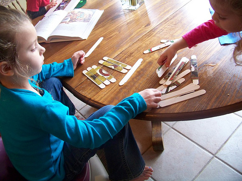 Kids making holiday decorations.